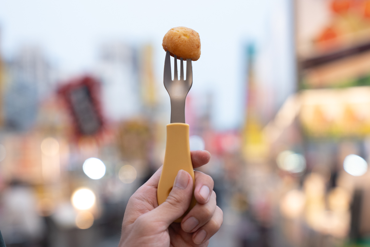night market with clicking cultery forked a snack
